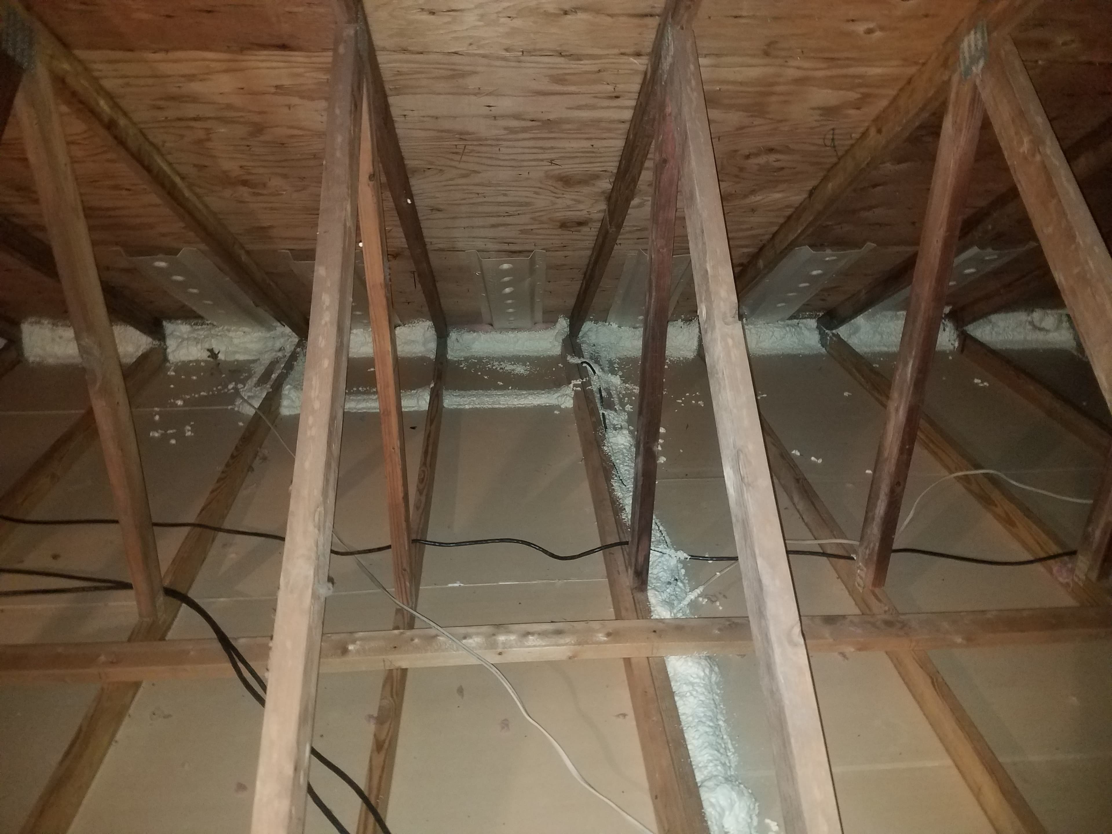 Retrofit insulation being added to an existing attic