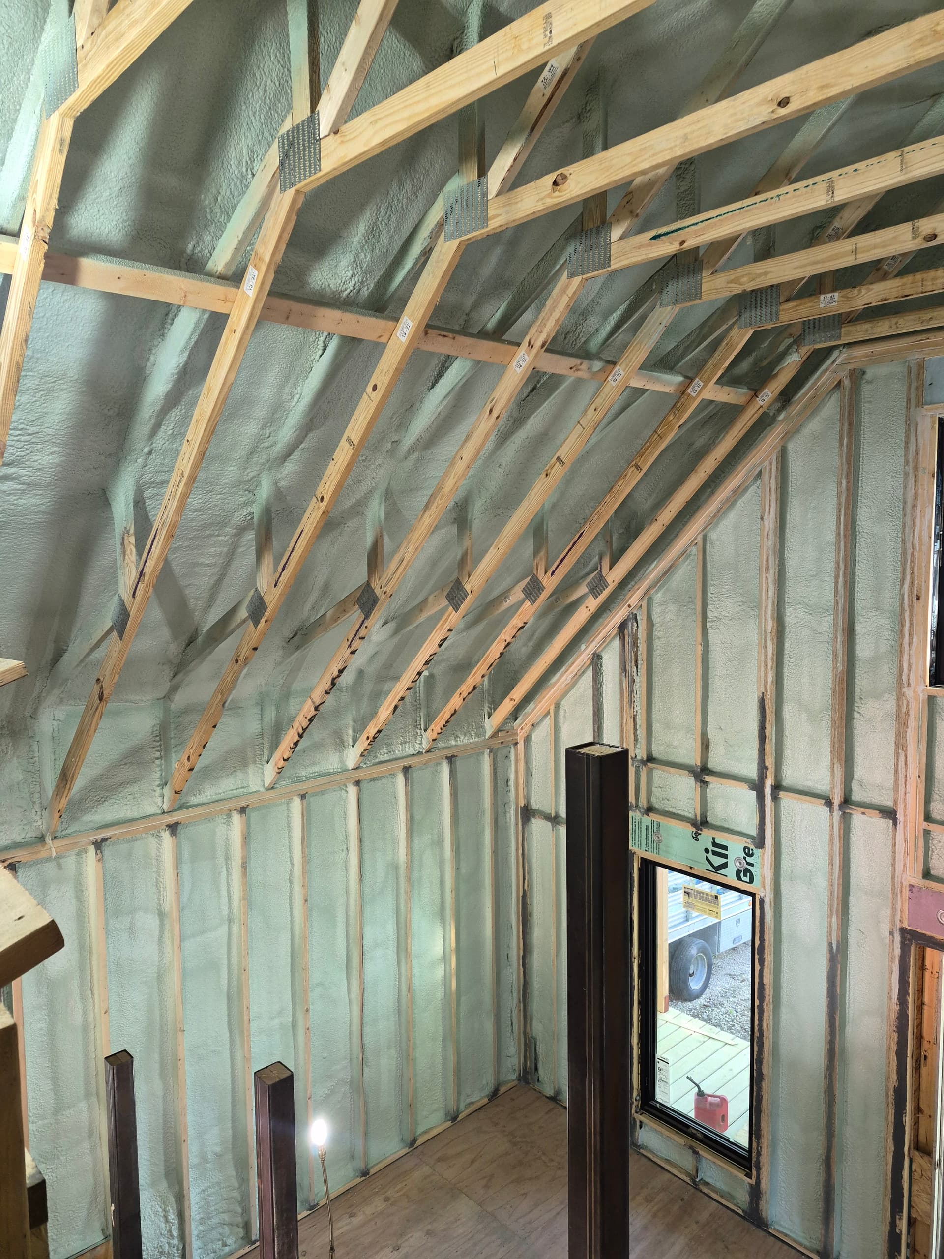 Spray foam insulation being applied